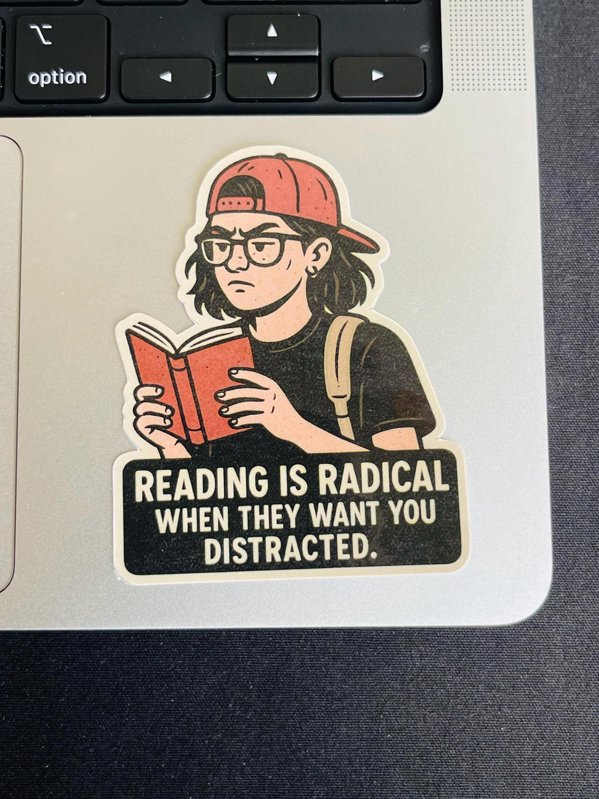 "Reading Is Radical When They Want You Distracted" Vinyl Sticker – Bookish Resistance Quote for Teens