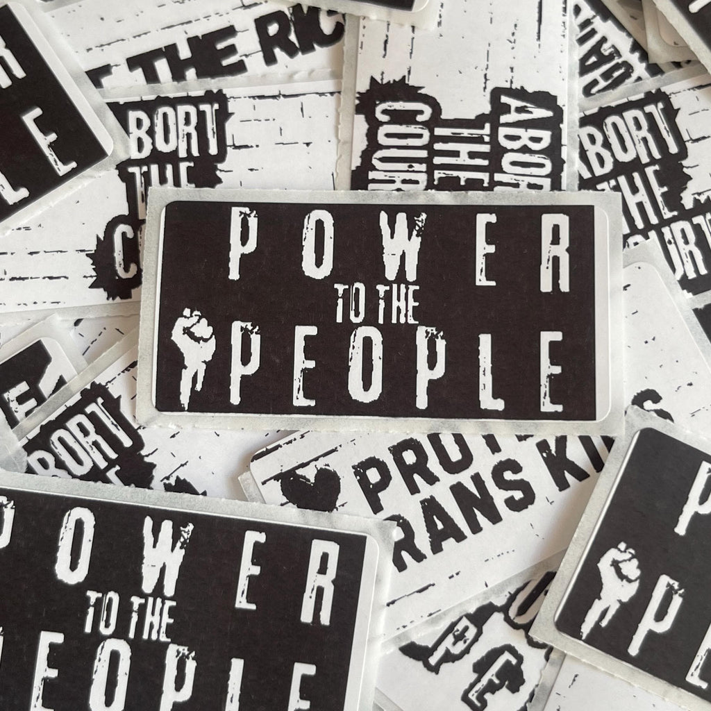 Stickers with 'Power to the People' text and graphics on a white background